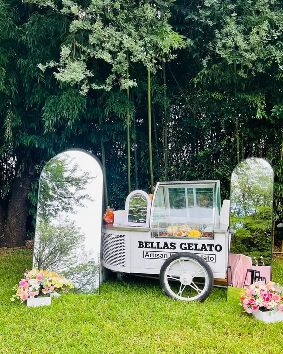 Bellas Gelato cart styled with garden arches and florals